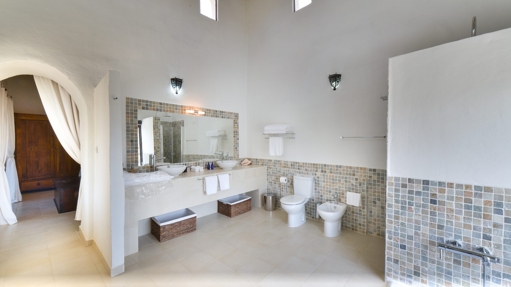 A mosaic-tiled bathroom