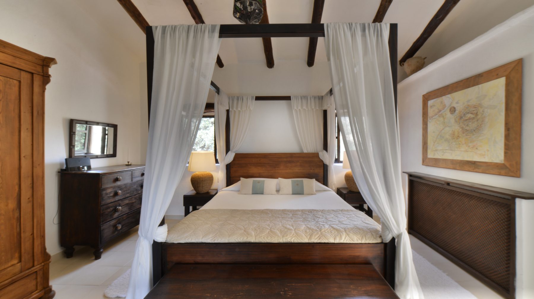 Canopy bed and antique dresser