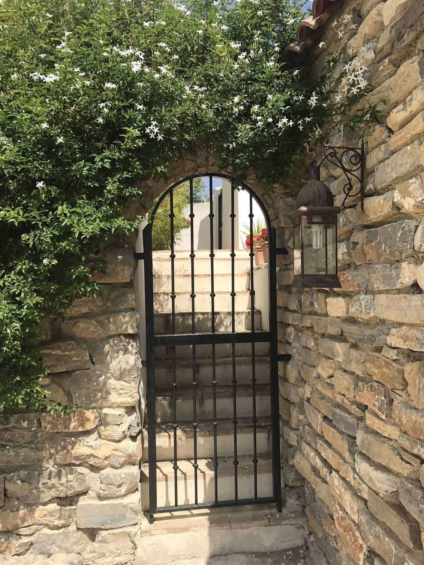 A stone gateway frames the view