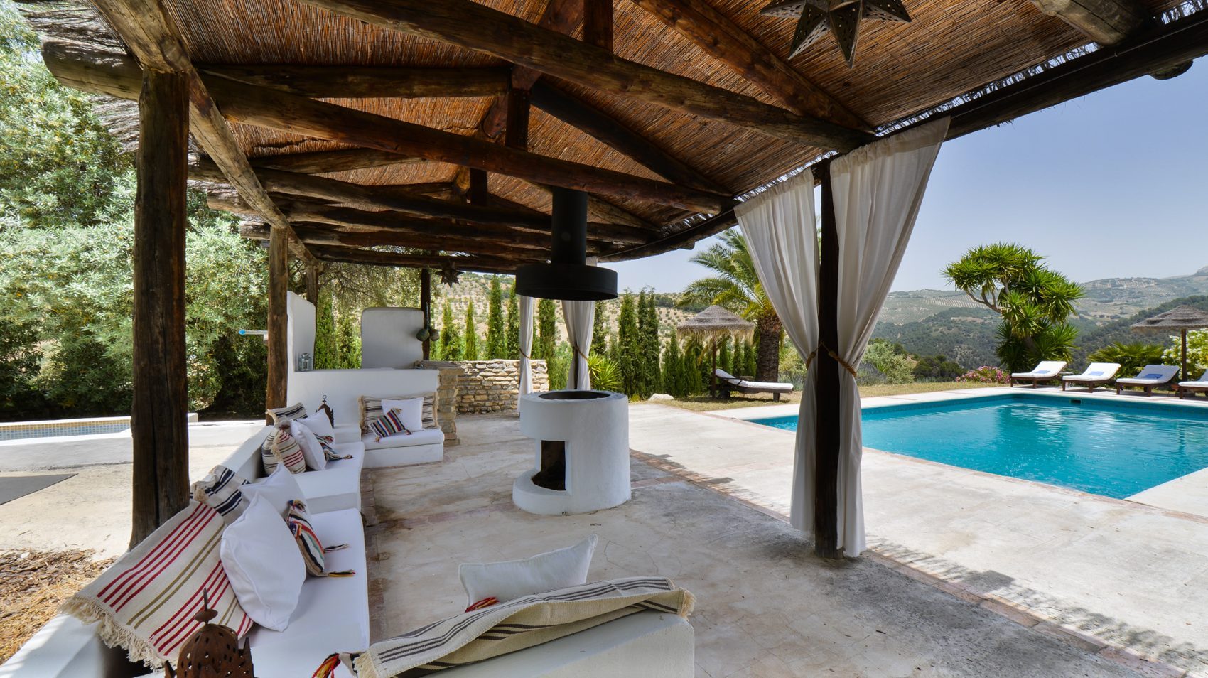 Shaded terrace lounge by the pool